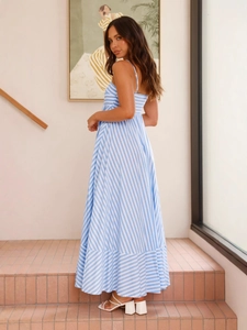Sleeveless backless maxi dress with blue and white stripes and flowing wave hemline