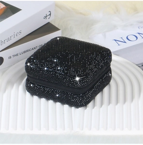Detailed view of luxury black rhinestone jewelry box with high-shine crystals and zipper