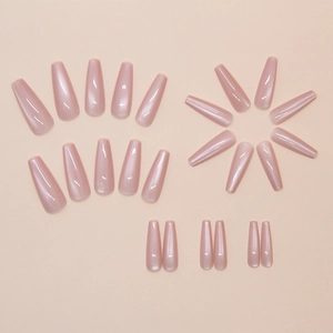 Close-up of translucent pink cat eye press-on nails in long ballerina shape with shimmer