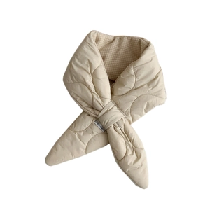 Pluffy cream white quilted cross neck warmer scarf with a stylish brand label