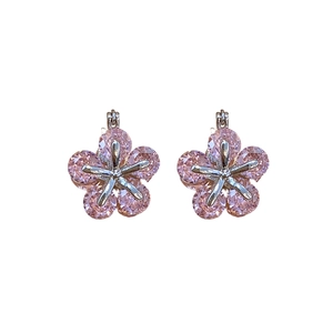 Elegant silver earrings with pink zircon flower crystals on a clean white background