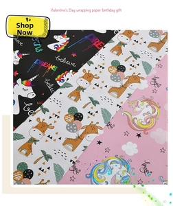 Detail of premium cartoon wrapping paper with unicorns and giraffes for birthday gifts