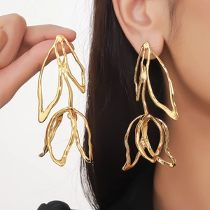 Exaggerated golden leaf flower earrings with abstract hollow metal design for women