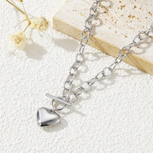 Silver stainless steel chain necklace with heart pendant and OT buckle on stone