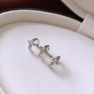 Detailed macro view of silver T-shaped ring with pavé zircon in jewelry box