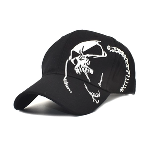 Classic black cotton baseball cap with white skull embroidery and a street style curved brim