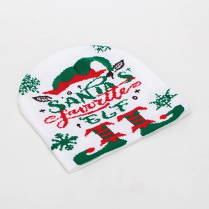 Detailed view of white Christmas beanie featuring Santa's Favorite Elf knitted pattern