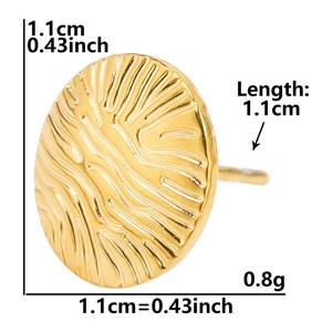 Macro shot of gold round earrings with ripple texture and measurement details