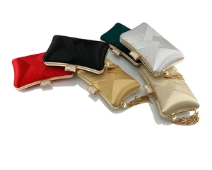 Detail view of woven satin evening bags with rhinestone clasps in various colors