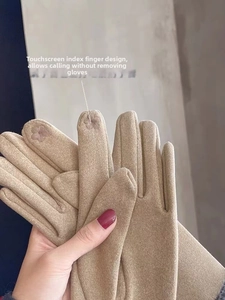 Detail of khaki thermal knit gloves featuring floral embroidery for touchscreen use