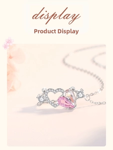Close-up of heart-shaped 925 silver necklace with pink crystal and pavé set stones