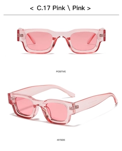 Close-up of pink transparent square sunglasses with thick temples and hinge details