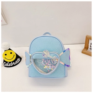 Detail showing blue sequin glitter texture and transparent heart pocket on child backpack