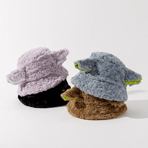 Detail of colorful plush bucket hats with lamb ears in purple, black, blue and brown