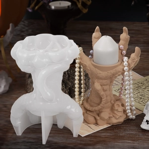 Macro detail of gothic demon claw candle holder silicone mold with skull base design