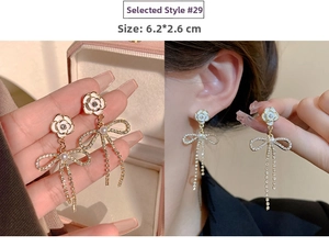 Detail of 925 silver needle tassel earrings with camellia flower and bowknot crystals