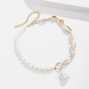 Detailed view of baroque pearl necklace with natural shells and golden adjustable chain