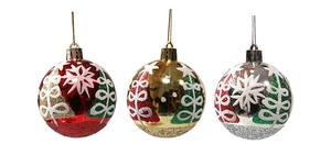 Detailed view of red, gold, and silver Christmas balls with glittery snowflake patterns