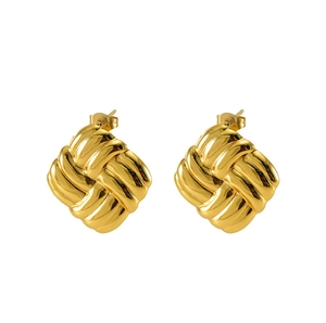 Macro detail of square textured 18k gold earrings with woven pattern and butterfly backings