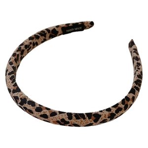 Padded leopard print headband with a soft sponge design and handmade label on white background