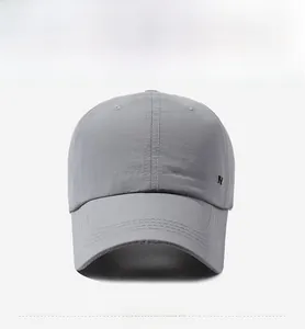 Detail of grey quick-dry baseball cap with SC FASHION embroidery on the side