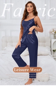 Detail of navy blue silk satin sleepwear set featuring thin straps and elegant drape