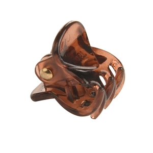 Close-up of amber tortoiseshell hair claw clip with a strong golden metal spring