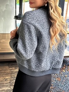 Back view of a grey plush buttoned jacket with ribbed cuffs for casual autumn wear
