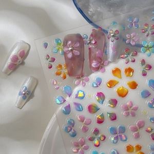 3D embossed floral nail stickers with iridescent pearls on transparent backing paper