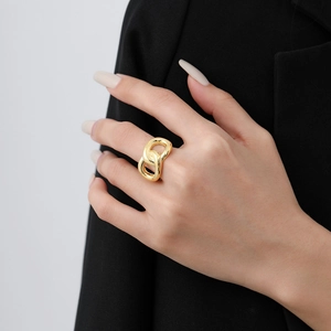 Fashionable knot design gold-plated ring for women shown on hand with minimalist style