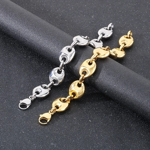 Detail of 18k gold and silver coffee bean pig nose link bracelets with lobster clasps