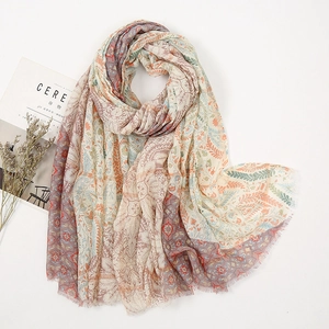 Detail view of Bohemian paisley pattern print scarf with soft fringe edges and golden silk