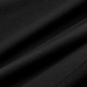 Macro view of high-density black polo shirt fabric with durable anti-wrinkle texture