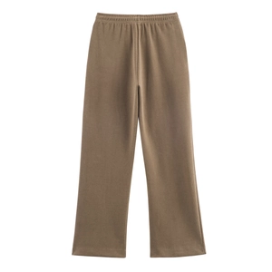 Detail of brown wide-leg lounge pants featuring a comfortable elastic waistband in soft fabric