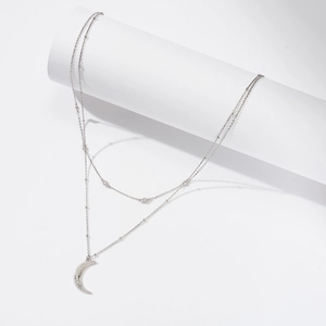 Detail of s925 silver double-layer necklace with a micro-pave moon pendant