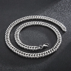 Detailed view of silver Cuban link chain necklace with polished stainless steel surface