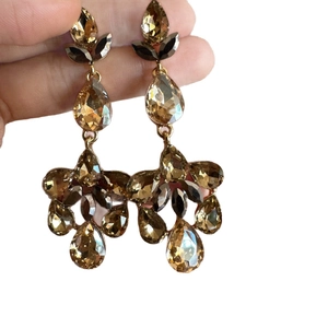 Elegant drop tassel earrings with champagne crystals and teardrop stones in gold plating