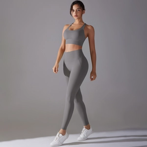 Detail view of seamless grey yoga set with racerback bra and high-waist sports leggings