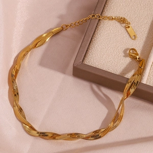 Detail of 18K gold plated double-strand braided blade chain anklet on pink silk