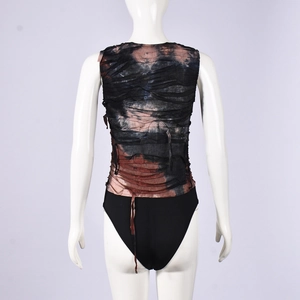 Close-up of earth tone tie-dye ruched fabric texture and back stitching on bodysuit