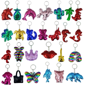 Variety of sequin animal keychains including unicorn and dolphin with colorful reflective scales