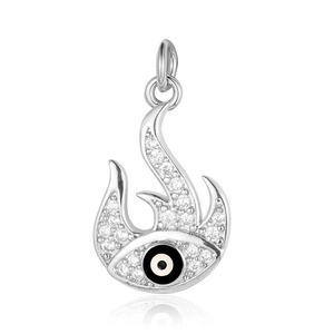 Macro detail of silver evil eye flame pendant with clear rhinestones and zircon inlay
