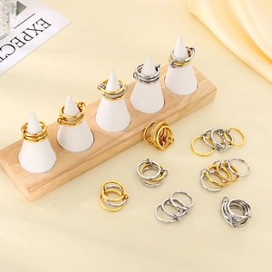 Stackable gold and silver rings with interlinked bands and micro-pave cubic zirconia accents