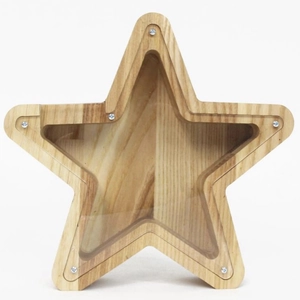 Macro shot of star-shaped oak wood money box with transparent acrylic panel and screws