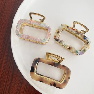 Three-piece acetate rectangular hollow hair claws in marble, colorful, and amber patterns
