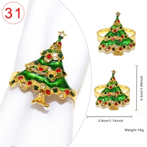 Detail of Christmas tree napkin ring with green enamel, rhinestones and golden star