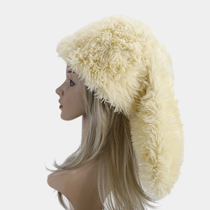 Detailed macro view of the soft fluffy plush texture and cream faux fur of the rabbit ear hat