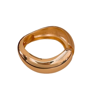 Minimalist wide irregular golden bangle with mirror polished finish for women