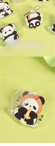 Detail of transparent acrylic panda brooch with protective film removal instruction