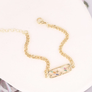 Gold Cuban link bracelet featuring a rectangle pendant with stars and colorful zircon